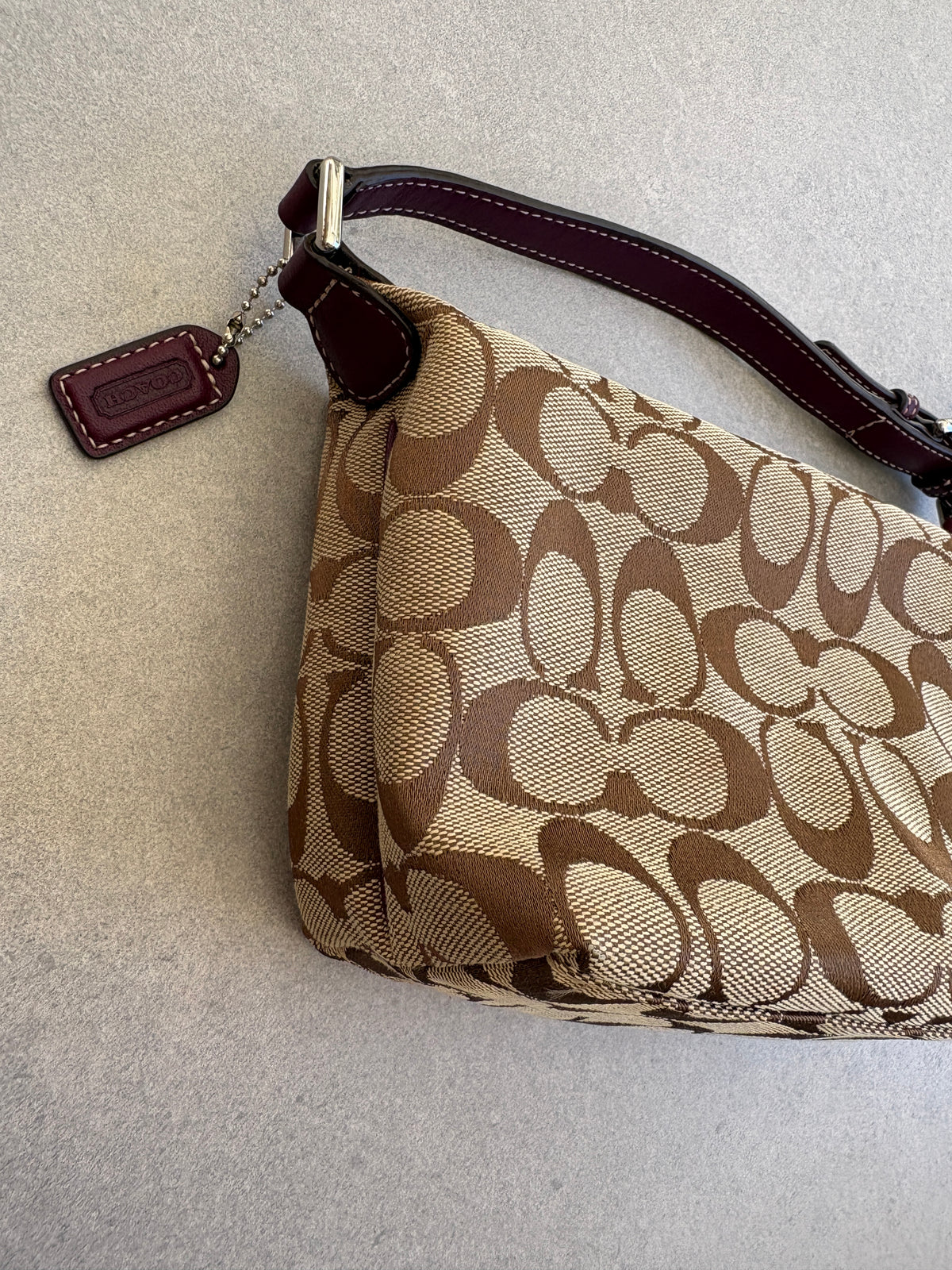Coach Brown Monogram Signature Pouch with Purple Tag
