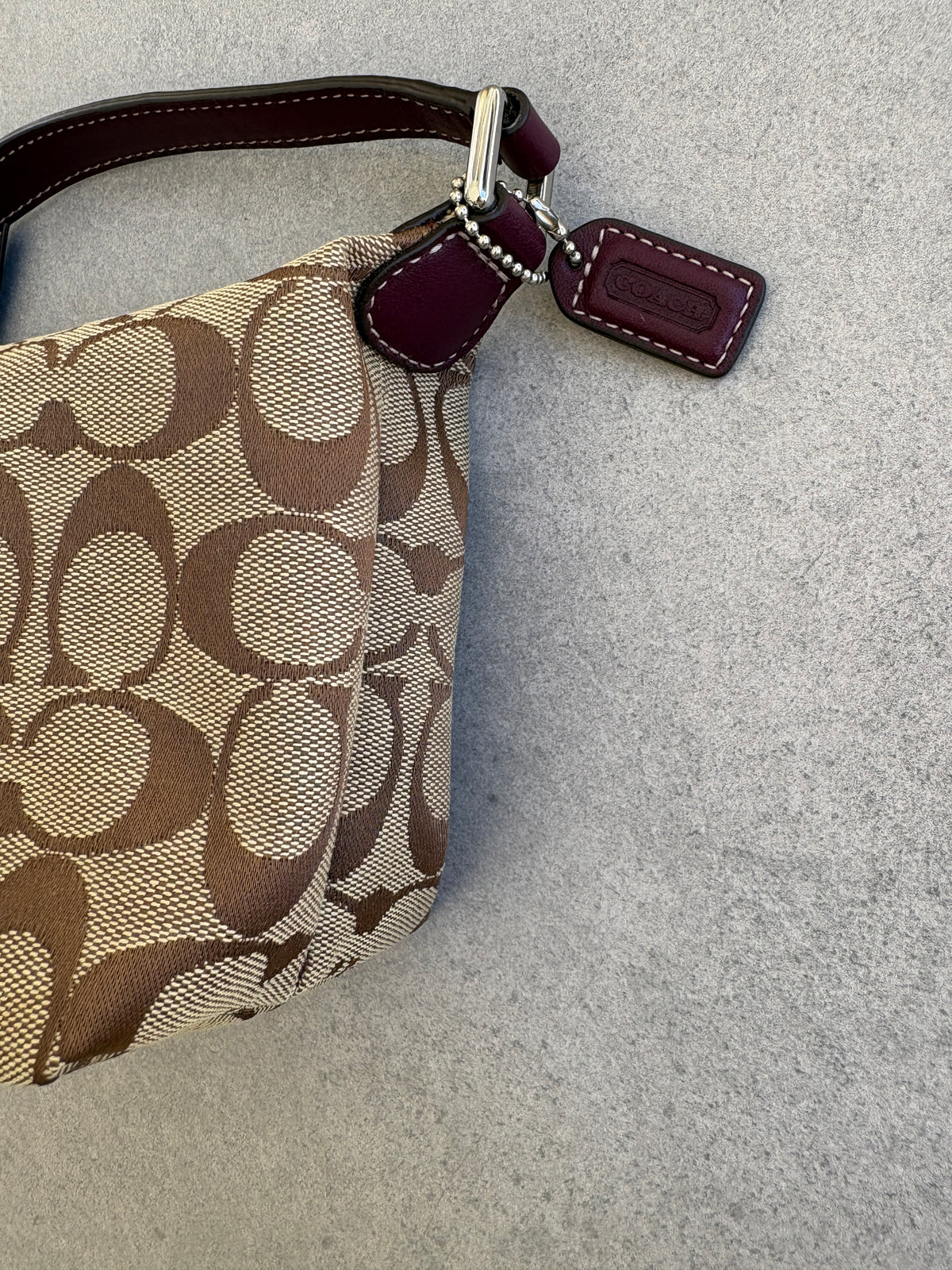 Coach Brown Monogram Signature Pouch with Purple Tag