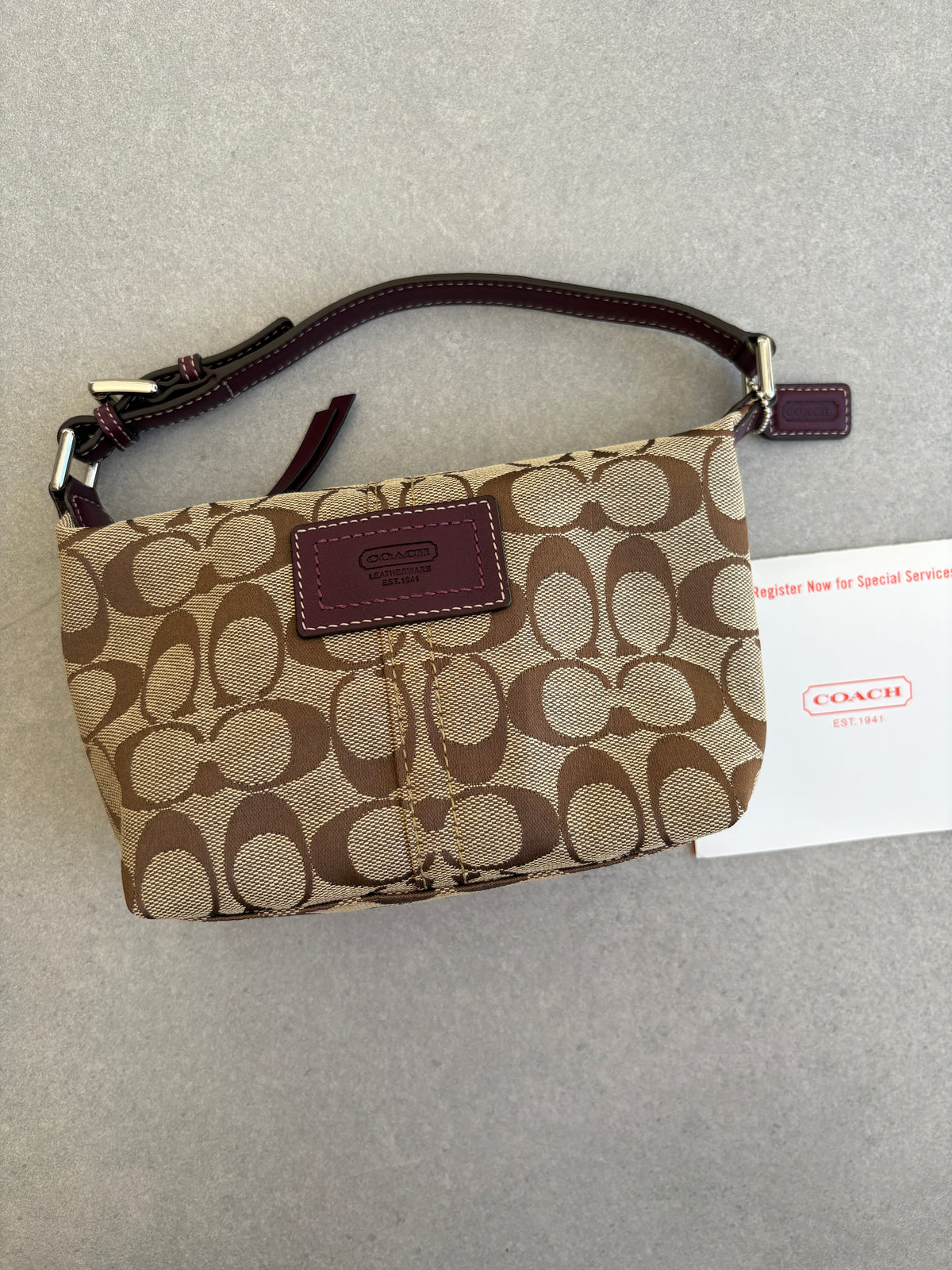 Coach Brown Monogram Signature Pouch with Purple Tag