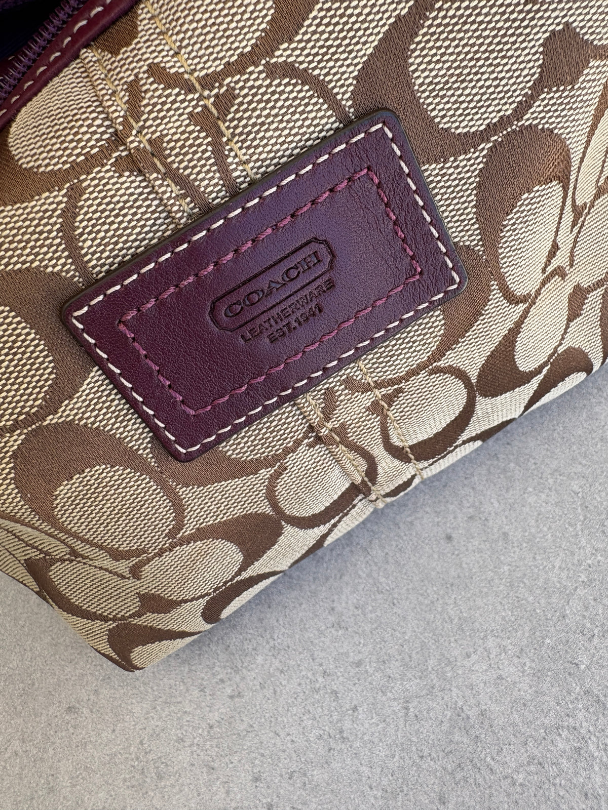 Coach Brown Monogram Signature Pouch with Purple Tag