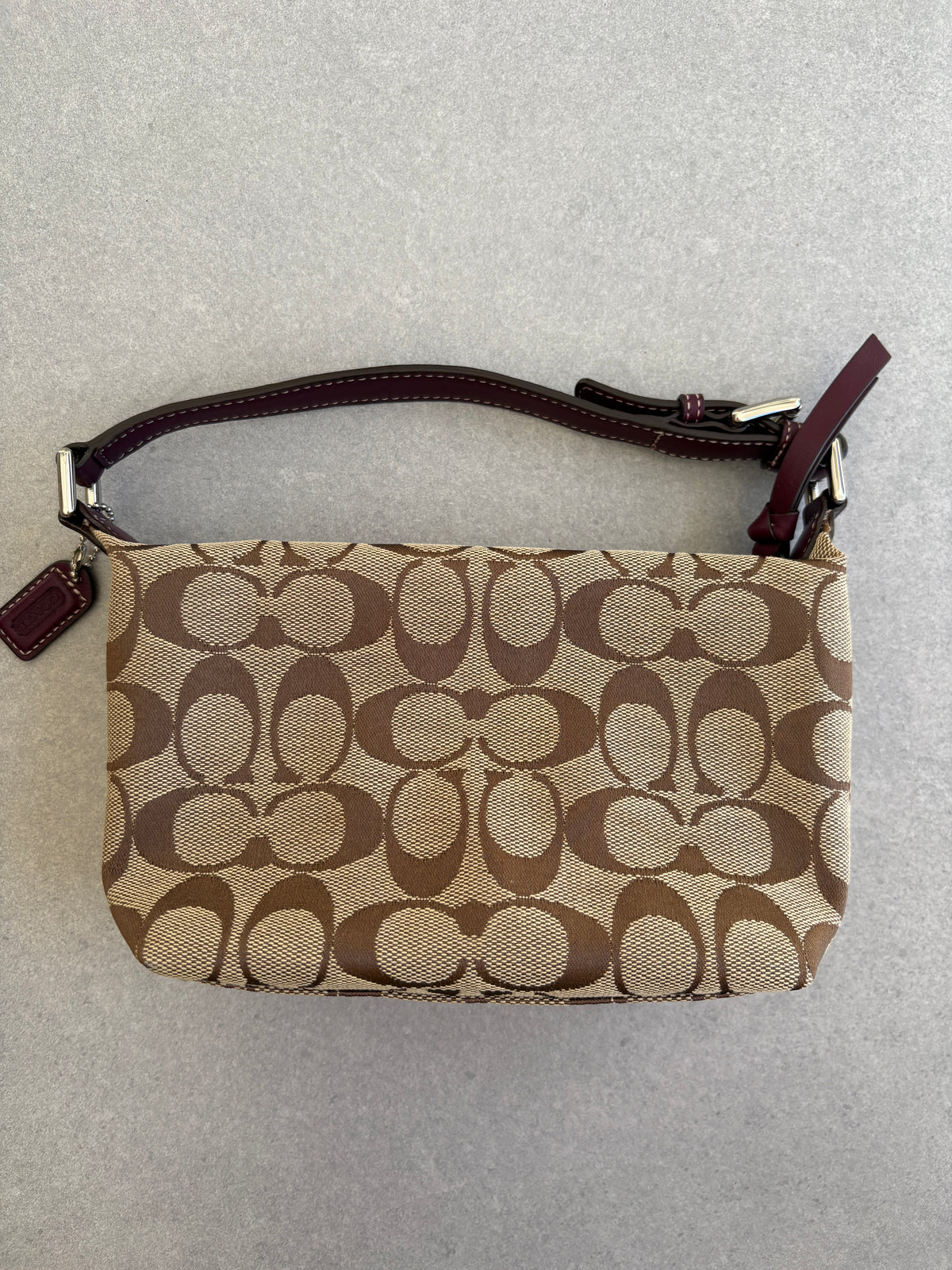 Coach Brown Monogram Signature Pouch with Purple Tag